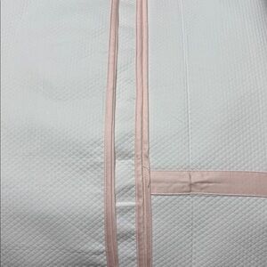 Look Linen Co. Twin coverlet. 100% cotton WhiteTextured Fabric with pink trim.